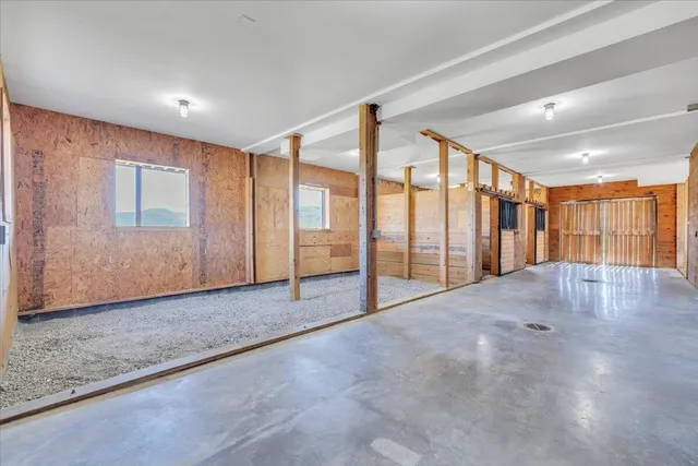 a view of a swimming pool with an outdoor seating and a yard