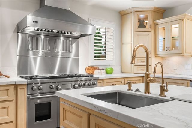 a kitchen with a stove and a sink