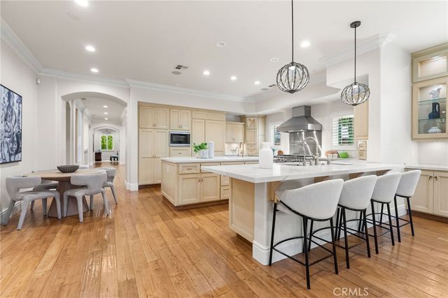 a large kitchen with a table and chairs