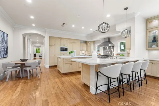 a large kitchen with a table and chairs