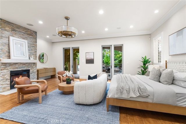 a bedroom with furniture and a fireplace