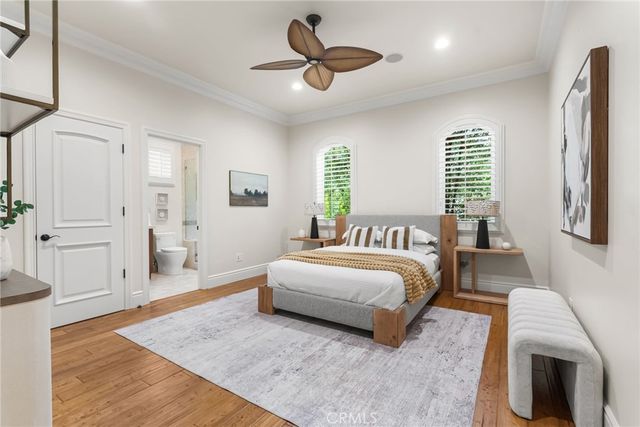 a spacious bedroom with a bed and a walk in closet