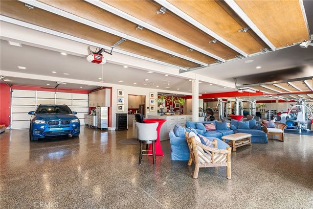 a living room with lots of furniture and clutter