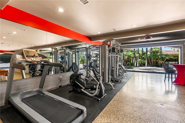 a room with lots of gym equipment