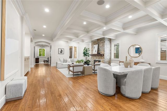 a living room with fireplace furniture and a wooden floor
