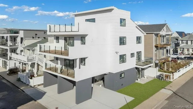a view of a white building among the street