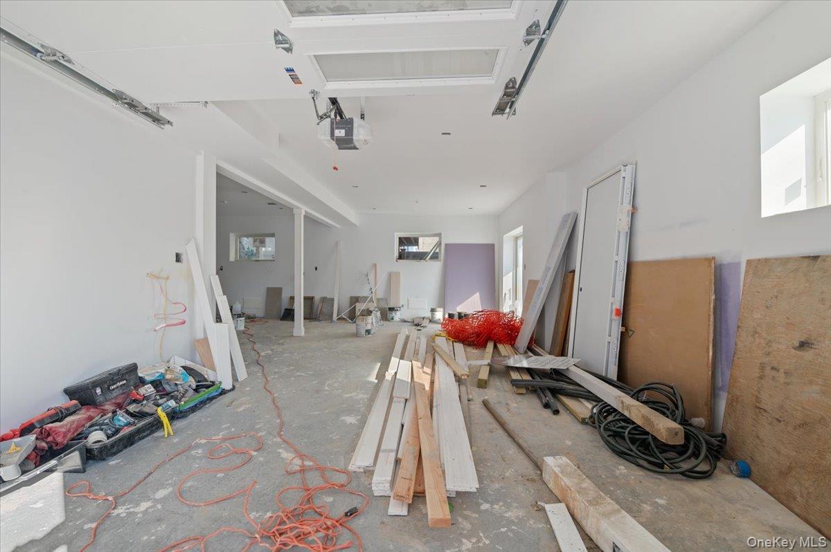 56 Oregon Street Long Beach, NY 11561 - Photo 19 of 25 Garage featuring a garage door opener