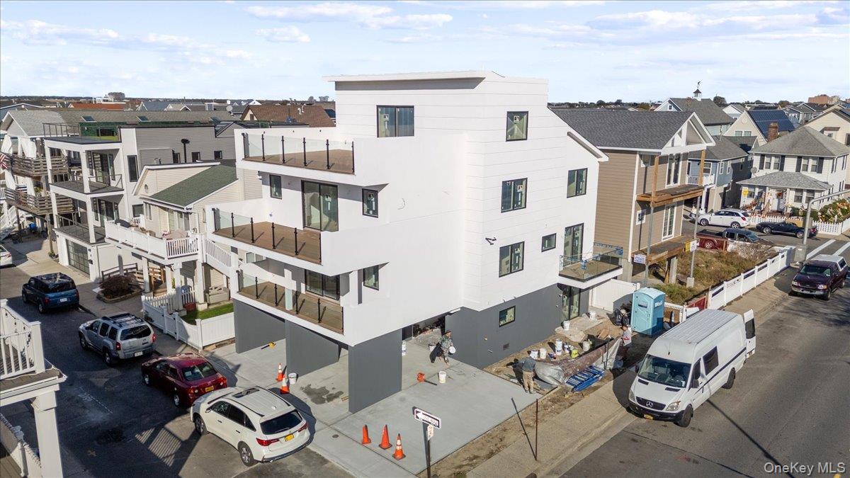 56 Oregon Street Long Beach, NY 11561 - Photo 22 of 25 View of building exterior with a residential view