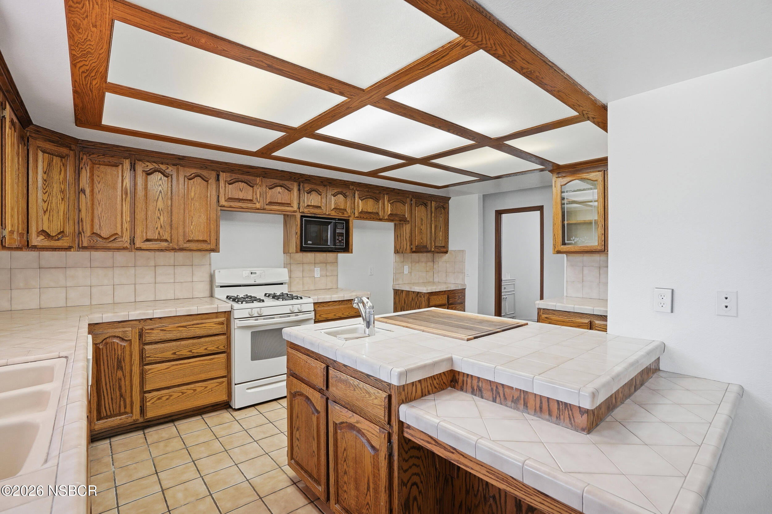 140 East Rice Ranch Road Santa Maria, CA 93455 - Photo 14 of 44 a kitchen that has a cabinets and a stove top oven