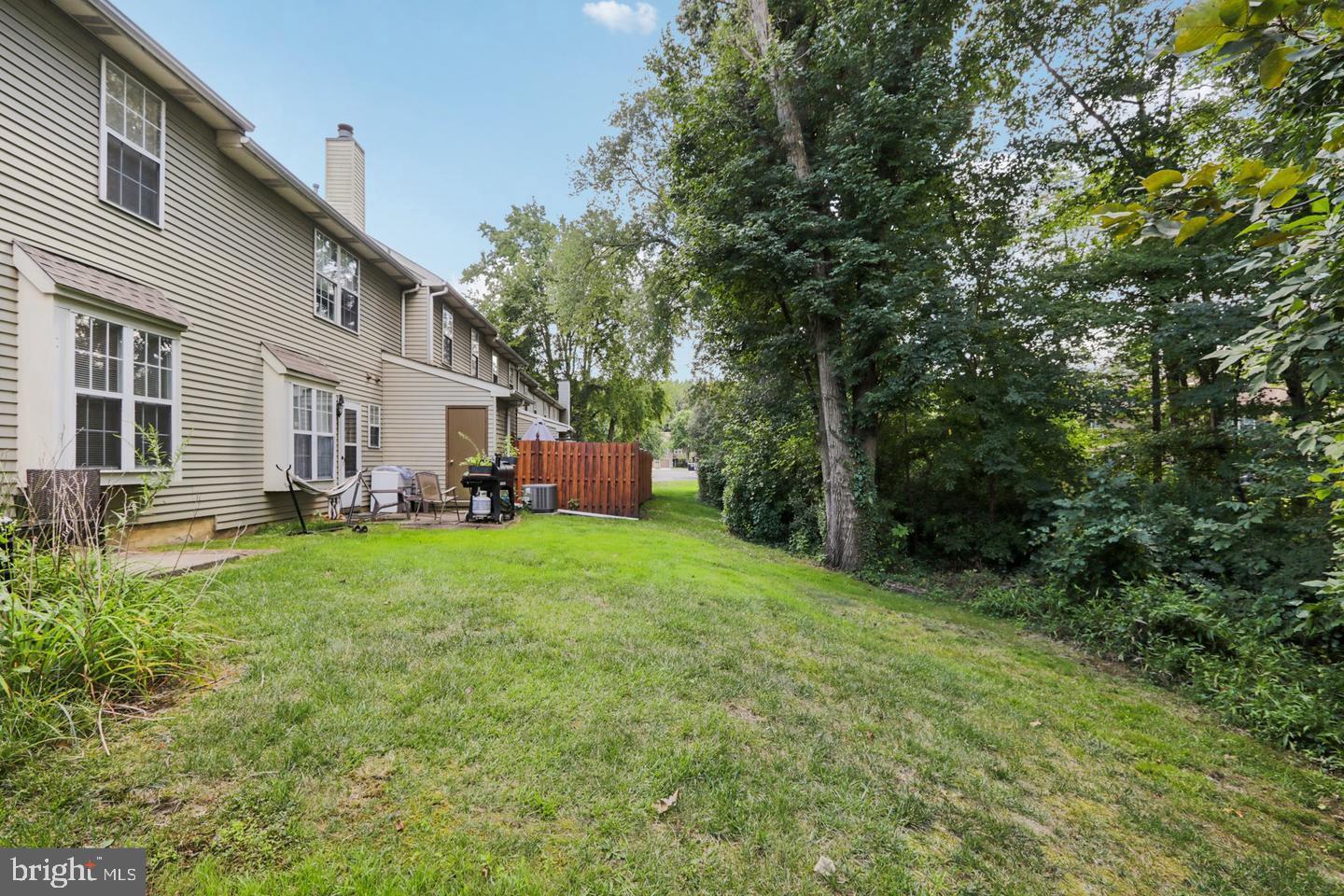 329 Gwynedd Court Mount Laurel, NJ 08054 - Photo 15 of 15 a backyard of a house with yard and trampoline