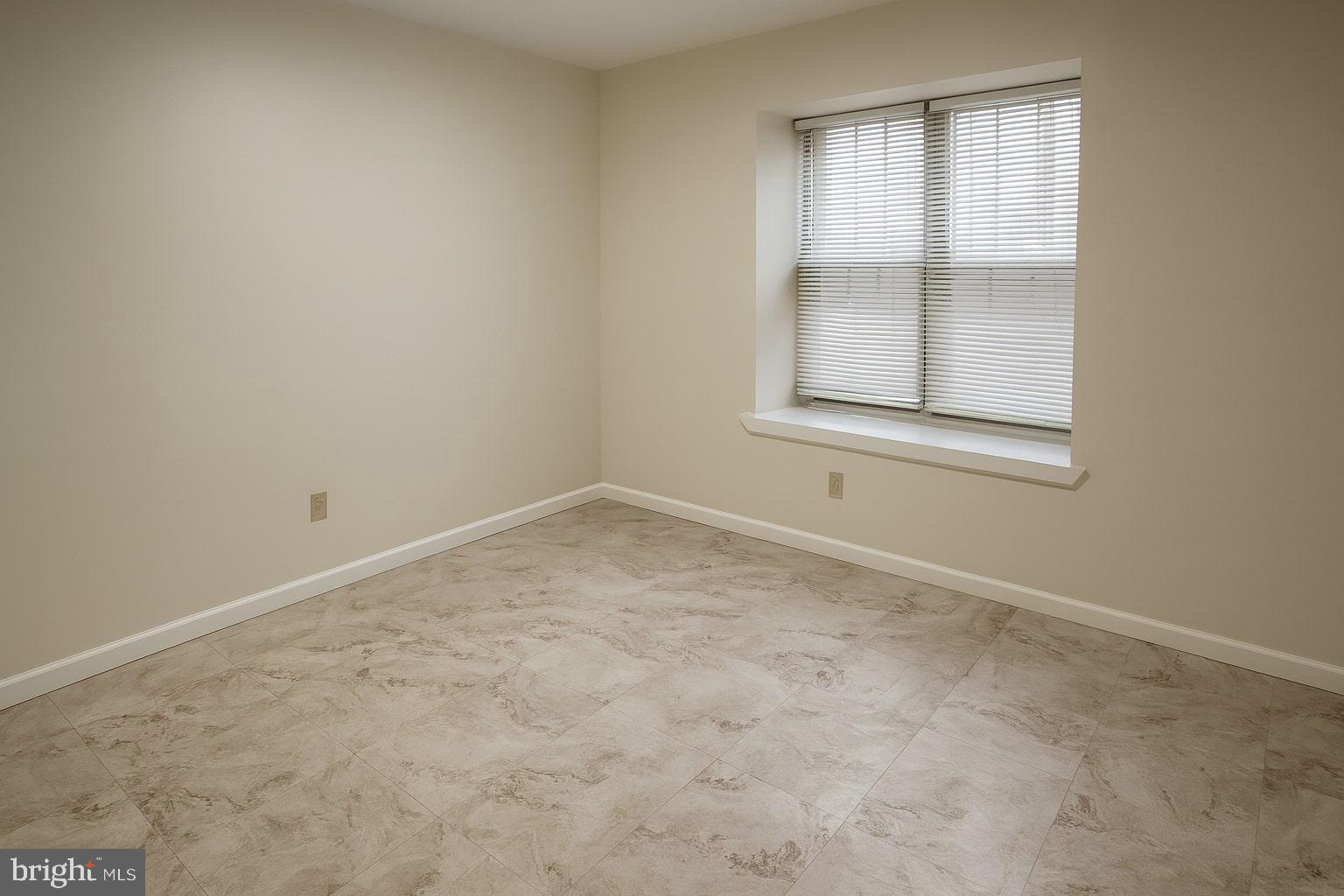 329 Gwynedd Court Mount Laurel, NJ 08054 - Photo 7 of 15 an empty room with a window