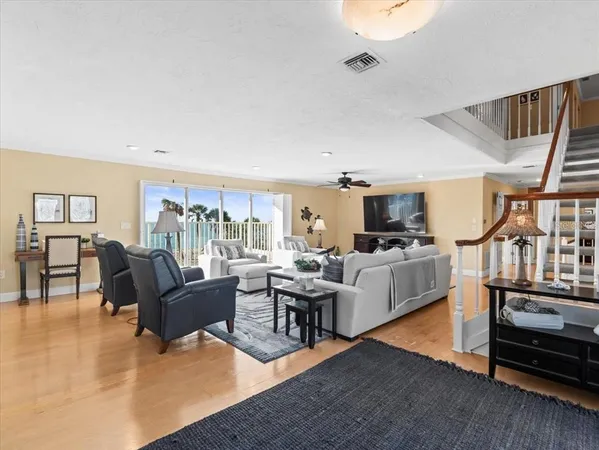 a bedroom with a bed couch and a large window