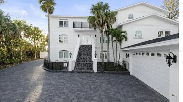 a view of a house with a yard and plants