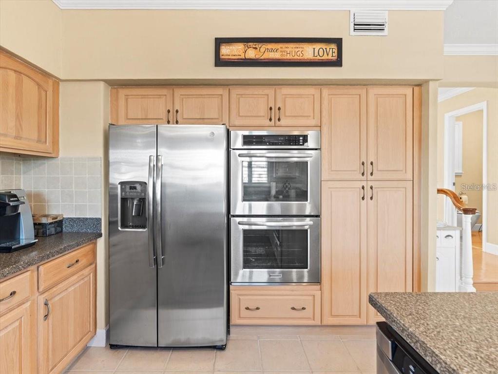 8030 Manasota Key Road Englewood, FL 34223 - Photo 22 of 67 a kitchen with stainless steel appliances granite countertop a refrigerator and a stove