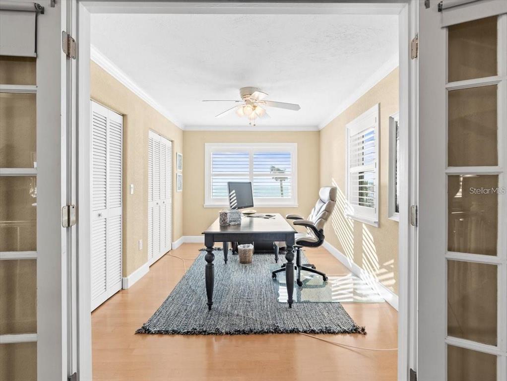 8030 Manasota Key Road Englewood, FL 34223 - Photo 27 of 67 a dining room with furniture window and wooden floor