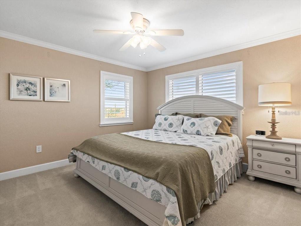 8030 Manasota Key Road Englewood, FL 34223 - Photo 28 of 67 a bedroom with a bed and a window