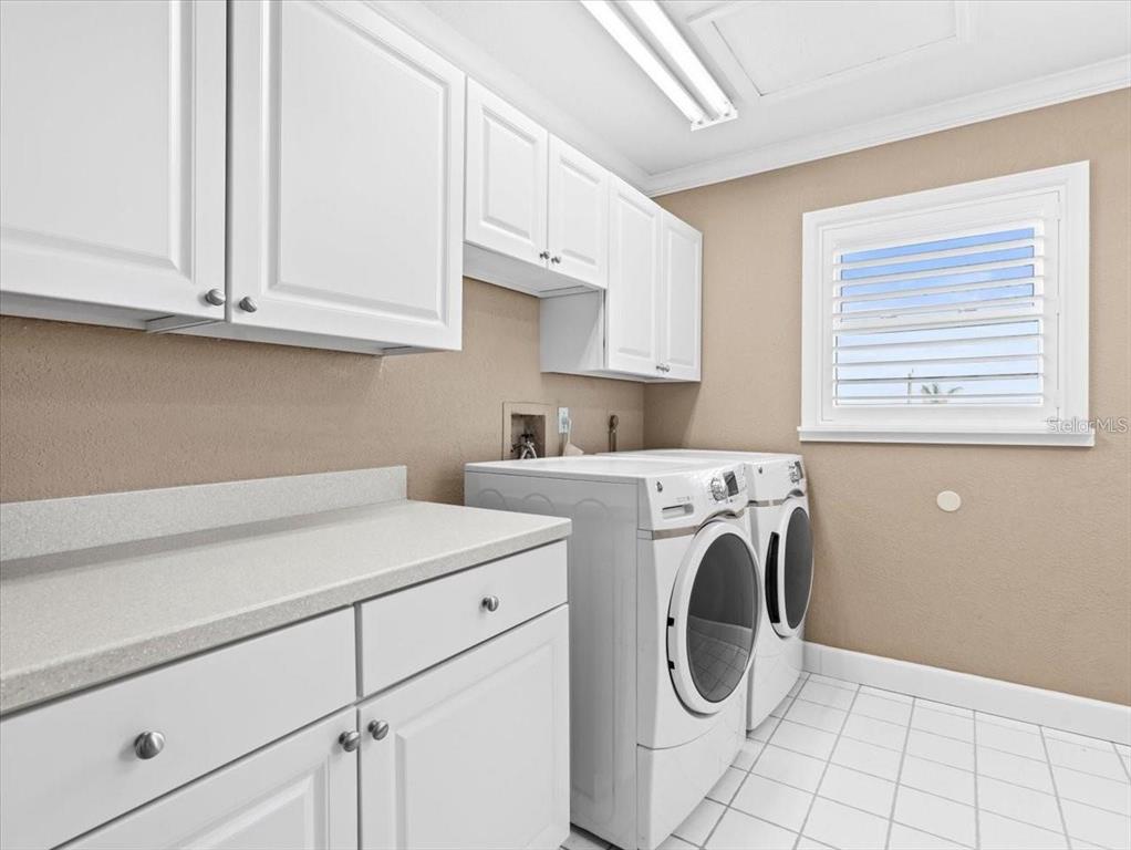 8030 Manasota Key Road Englewood, FL 34223 - Photo 31 of 67 a utility room with dryer and washer