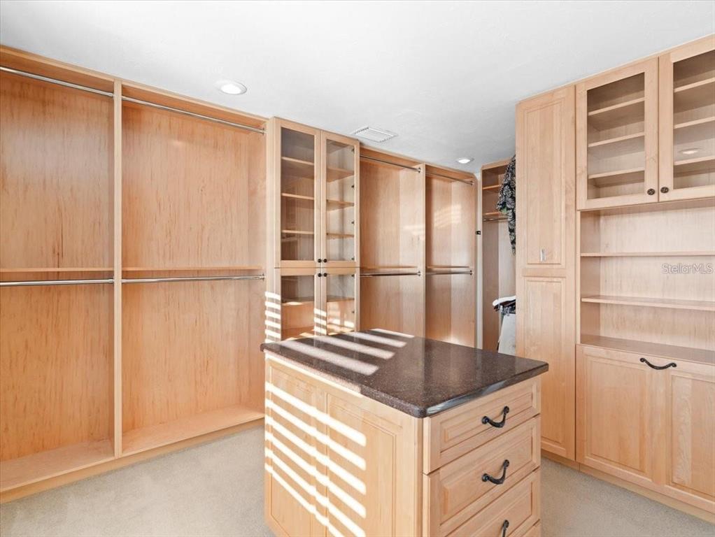 8030 Manasota Key Road Englewood, FL 34223 - Photo 36 of 67 a kitchen with granite countertop a sink and a refrigerator