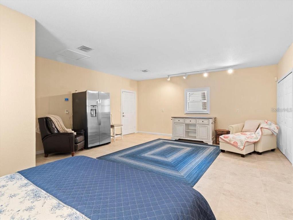 8030 Manasota Key Road Englewood, FL 34223 - Photo 59 of 67 a living room with furniture rug and a table