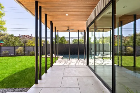 a front view of a house with a yard garage and outdoor seating