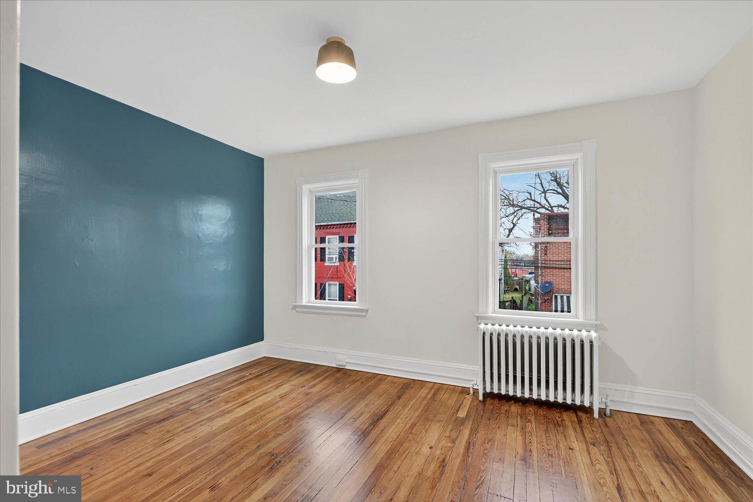 718 High Street Lancaster, PA 17603 - Photo 14 of 33 an empty room with wooden floor and windows