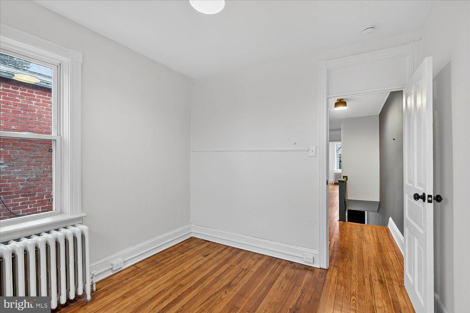 718 High Street Lancaster, PA 17603 - Photo 19 of 33 a view of a room with wooden floor and a bathroom