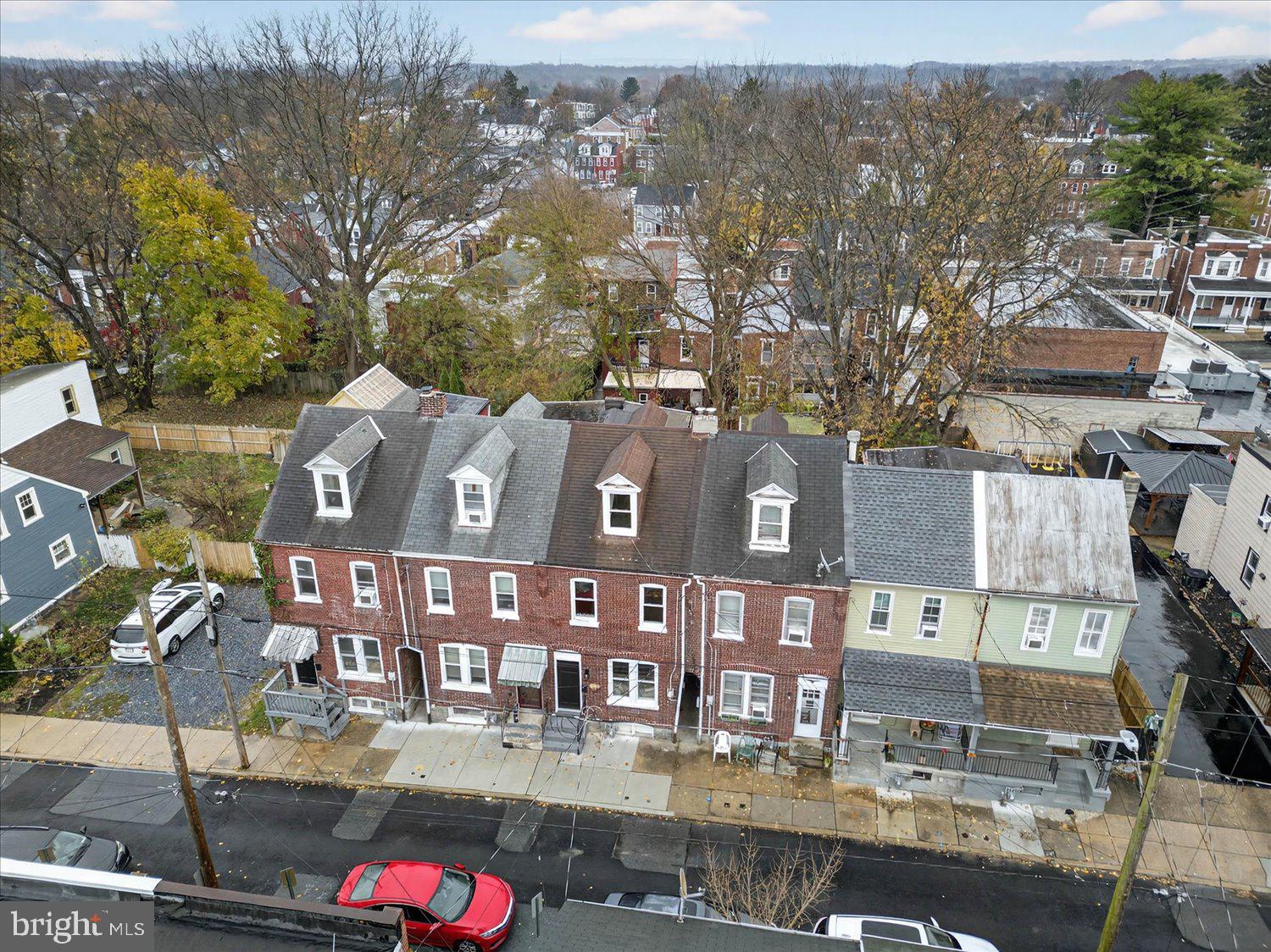 718 High Street Lancaster, PA 17603 - Photo 32 of 33 a front view of a residential apartment building with a yard