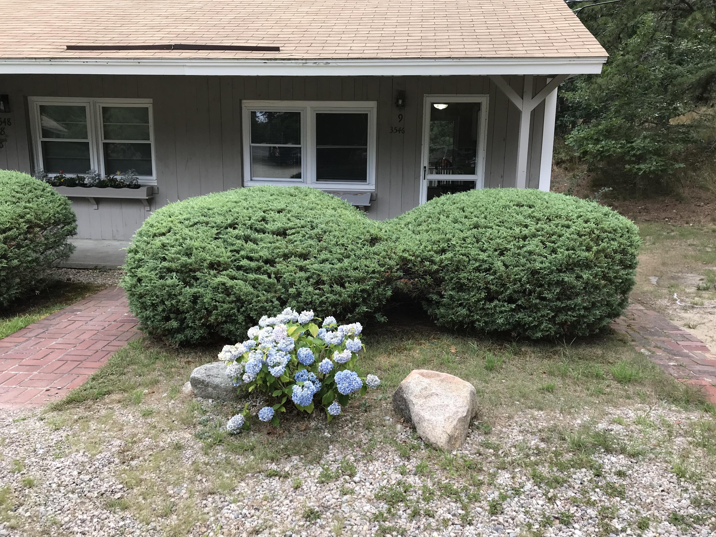 a front view of a house with a yard