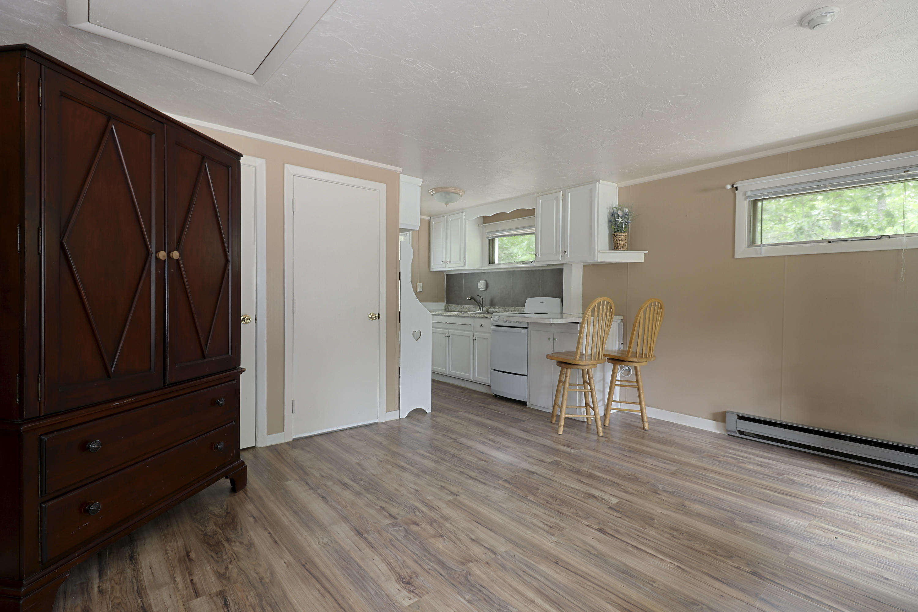 3546 Main Street, Unit 9 Brewster, MA 02631 - Photo 7 of 14 a view of a livingroom with furniture and wooden floor