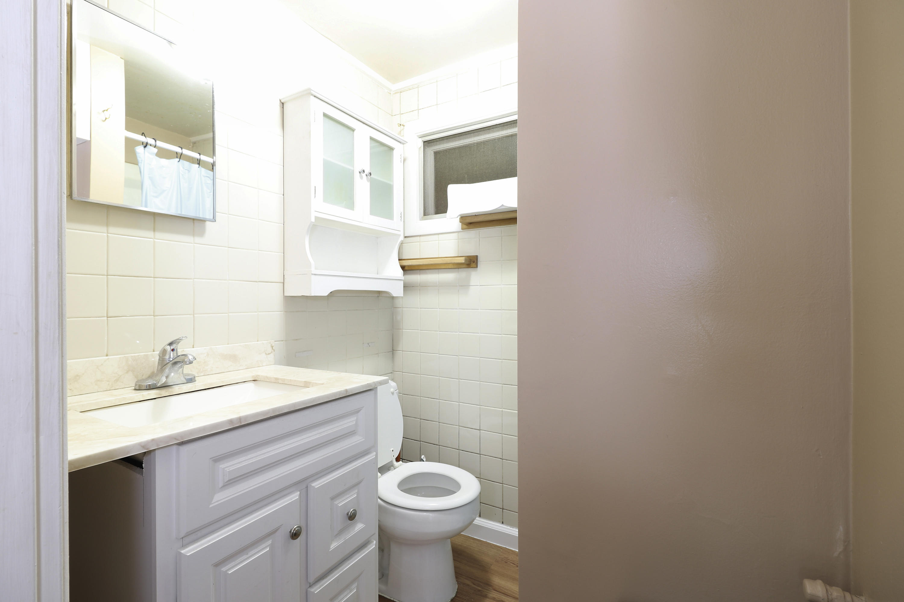 3546 Main Street, Unit 9 Brewster, MA 02631 - Photo 9 of 14 a bathroom with a sink a toilet and a mirror