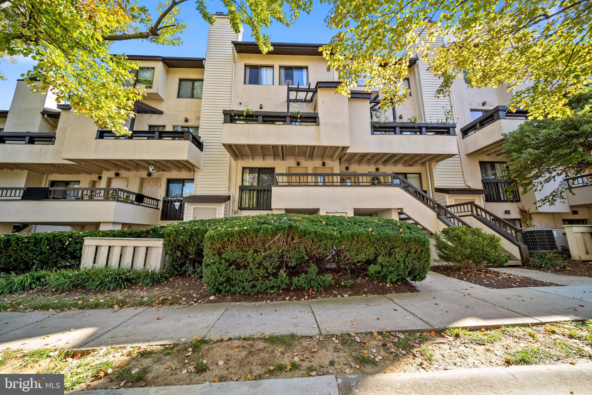 a front view of a building with garden