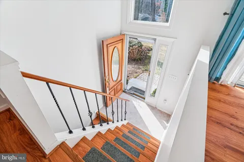 a view of kitchen with furniture and wooden floor
