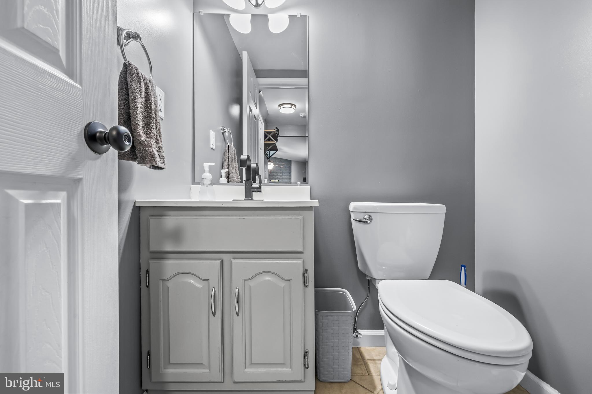 18 Kingsley Road Mount Holly, NJ 08060 - Photo 14 of 27 a white toilet sitting next to a bathroom sink