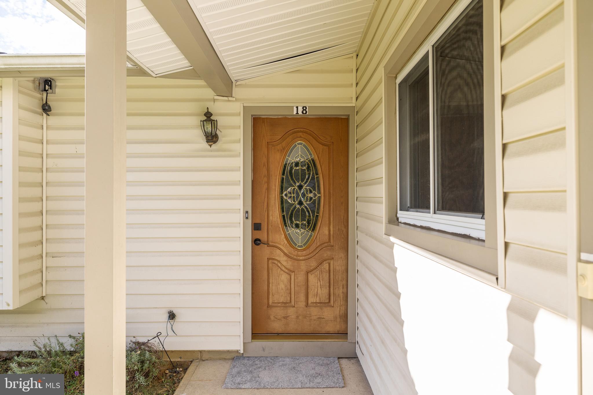 18 Kingsley Road Mount Holly, NJ 08060 - Photo 4 of 27 a front view of a house with a door