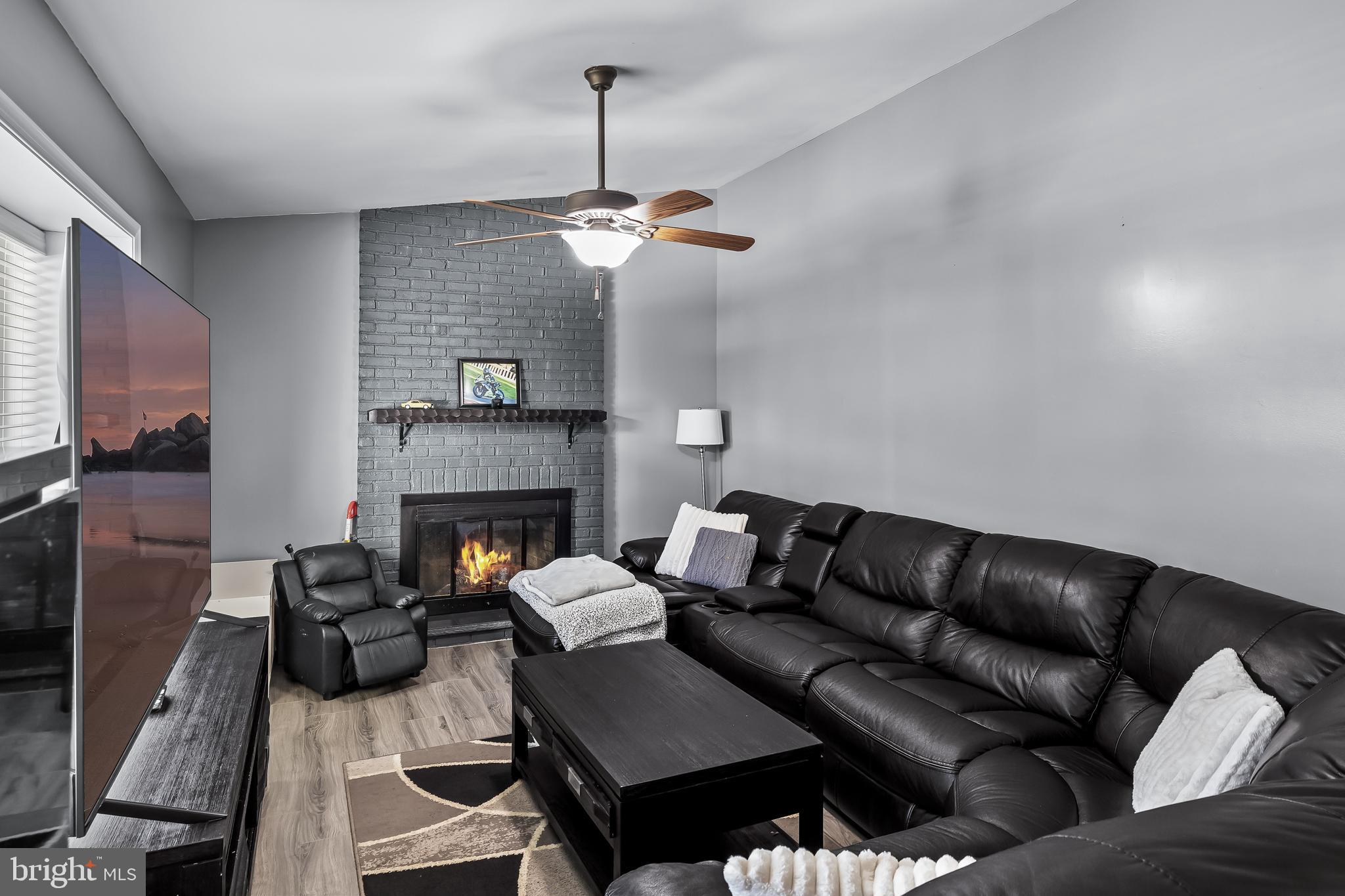 18 Kingsley Road Mount Holly, NJ 08060 - Photo 7 of 27 a living room with furniture and a fireplace