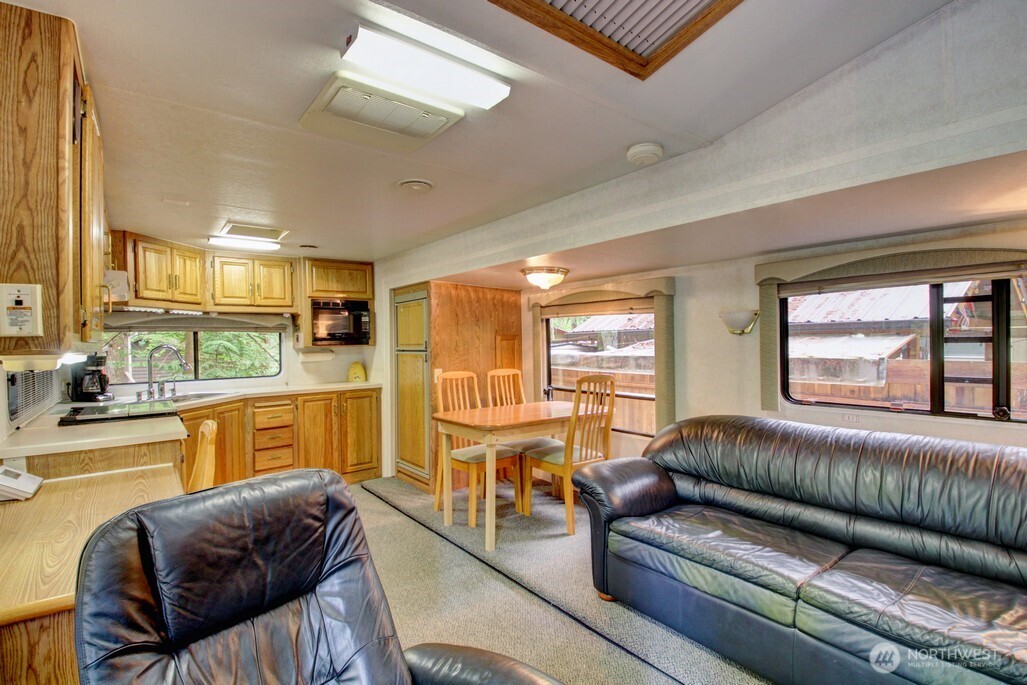 25-1 Goldrush Road Deming, WA 98244 - Photo 12 of 38 a living room with furniture and a large window