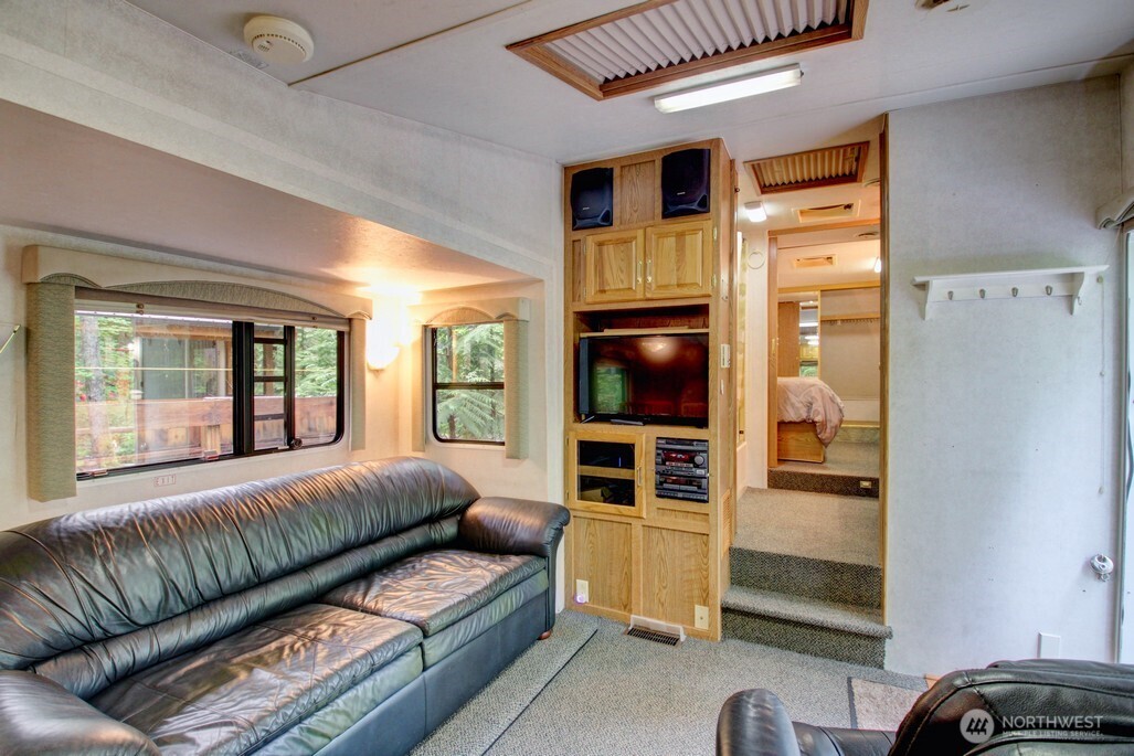 25-1 Goldrush Road Deming, WA 98244 - Photo 15 of 38 a living room with furniture and a flat screen tv