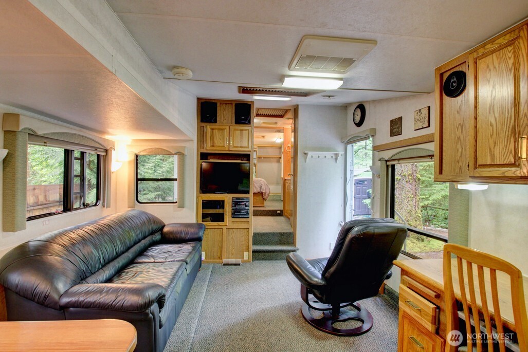 25-1 Goldrush Road Deming, WA 98244 - Photo 16 of 38 a living room with furniture or couch and a flat screen tv
