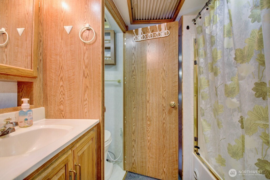 25-1 Goldrush Road Deming, WA 98244 - Photo 22 of 38 a bathroom with a sink and a mirror