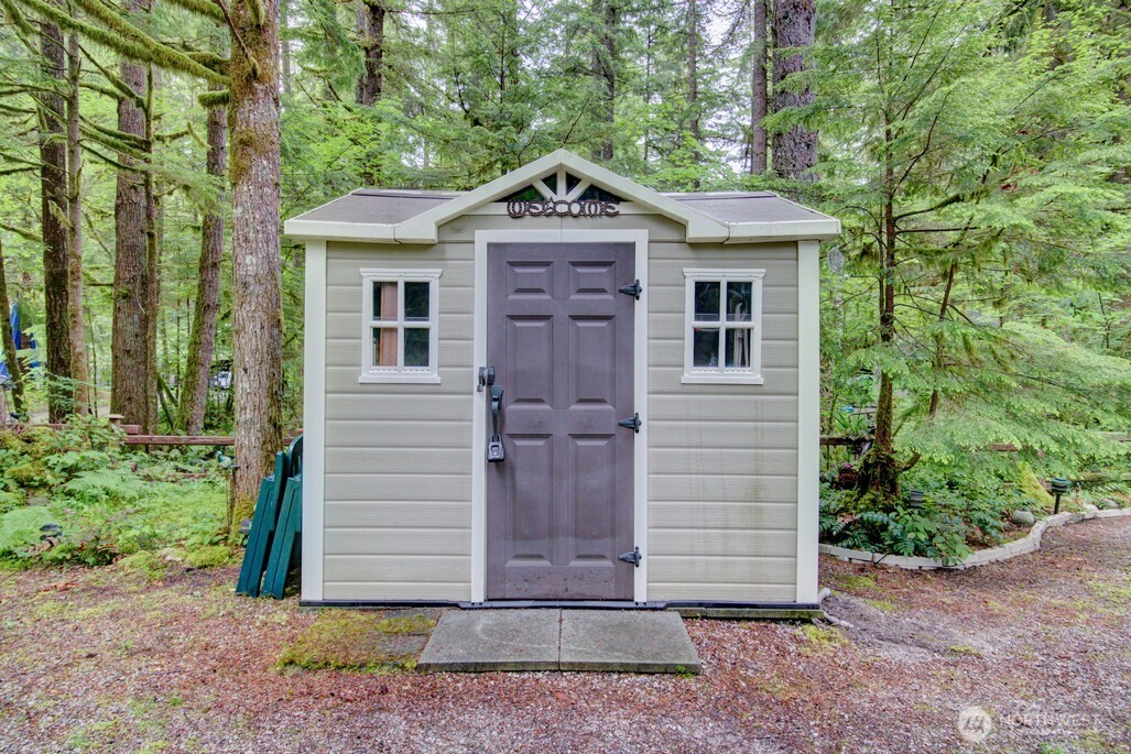 25-1 Goldrush Road Deming, WA 98244 - Photo 26 of 38 a front view of a house with a garden