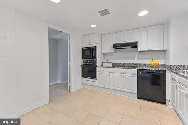 a view of an empty room with windows