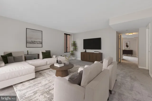 a spacious bedroom with a bed and a large window