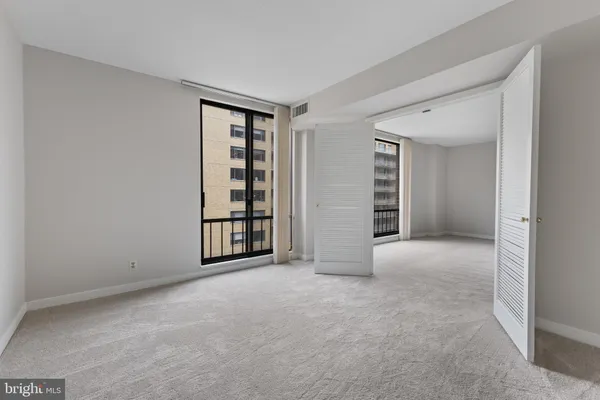 a view of an empty room with a window