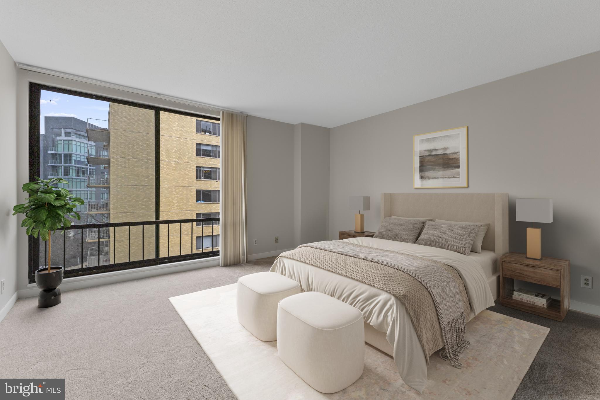1099 22nd Street Northwest, Unit 601 Washington, DC 20037 - Photo 22 of 41 a spacious bedroom with a bed and a large window