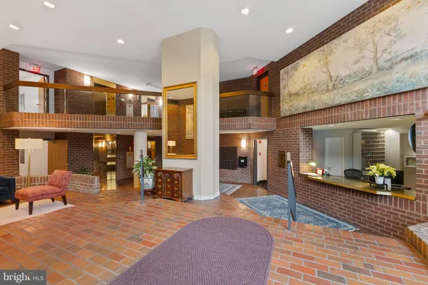 a lobby with furniture and dining table