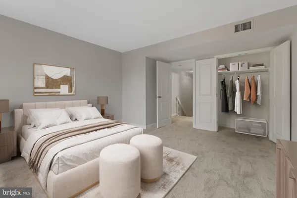 a bedroom with a bed and walk in closet