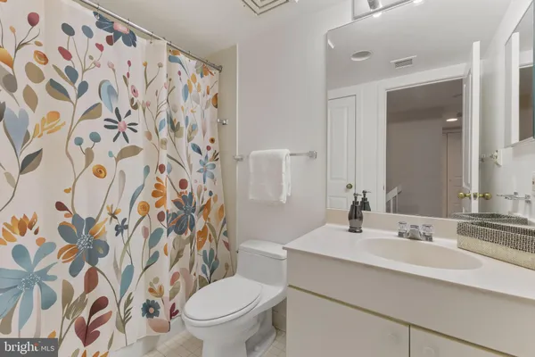a bathroom with a sink and toilet