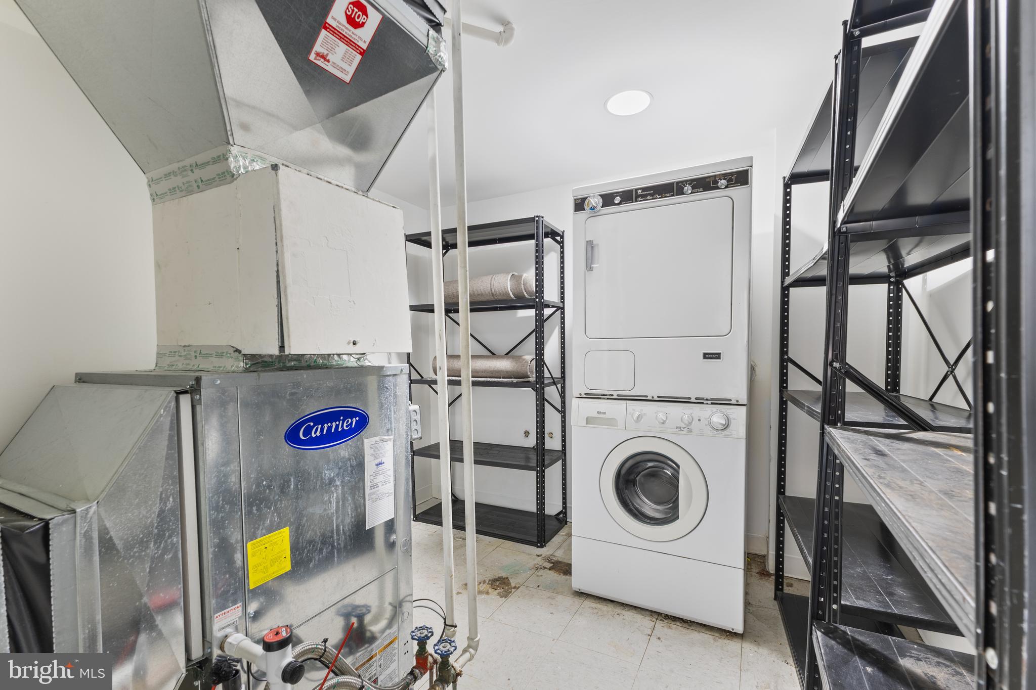 1099 22nd Street Northwest, Unit 601 Washington, DC 20037 - Photo 37 of 41 a utility room with dryer and washer