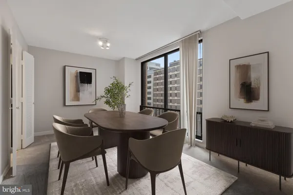 a dining room with furniture and window