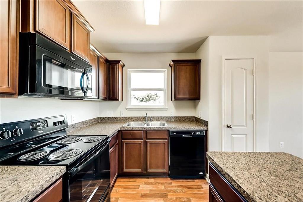 1810 Clegg Street Howe, TX 75459 - Photo 6 of 14 a kitchen with a stove and a sink